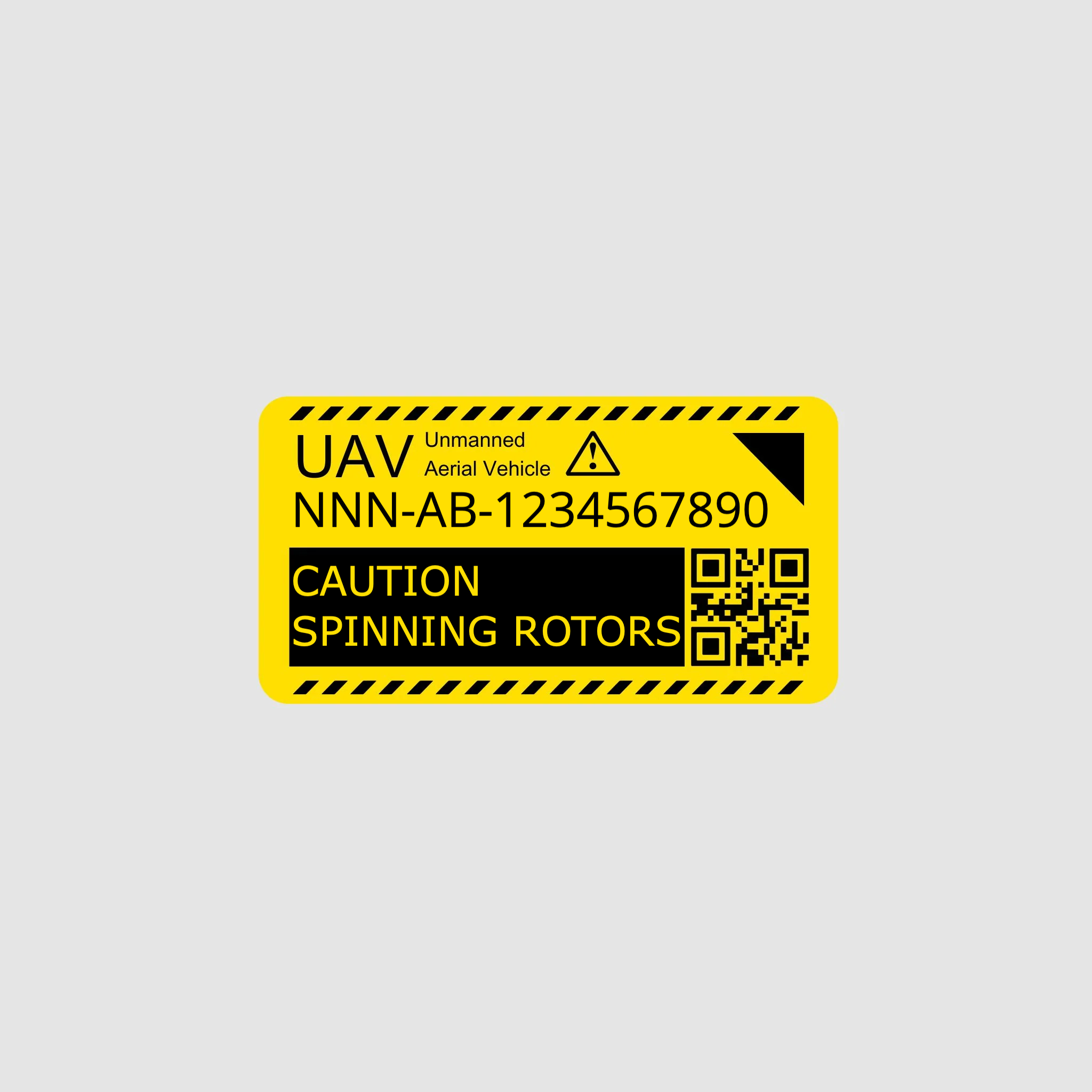 Yellow warning label for UAV with text and QR code on a gray background